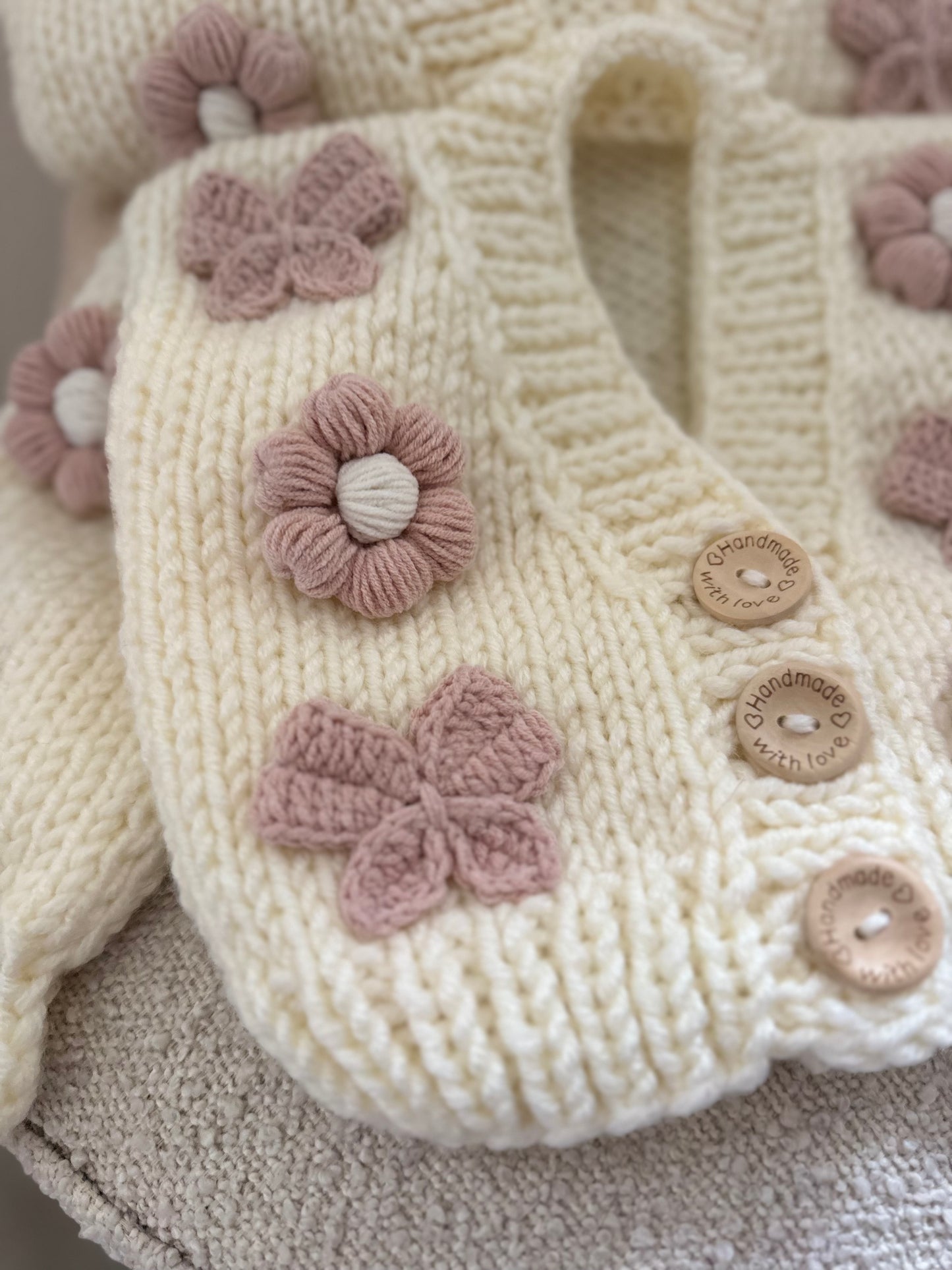 In stock hand knitted flower and chunky bow cardigan baby pink and cream