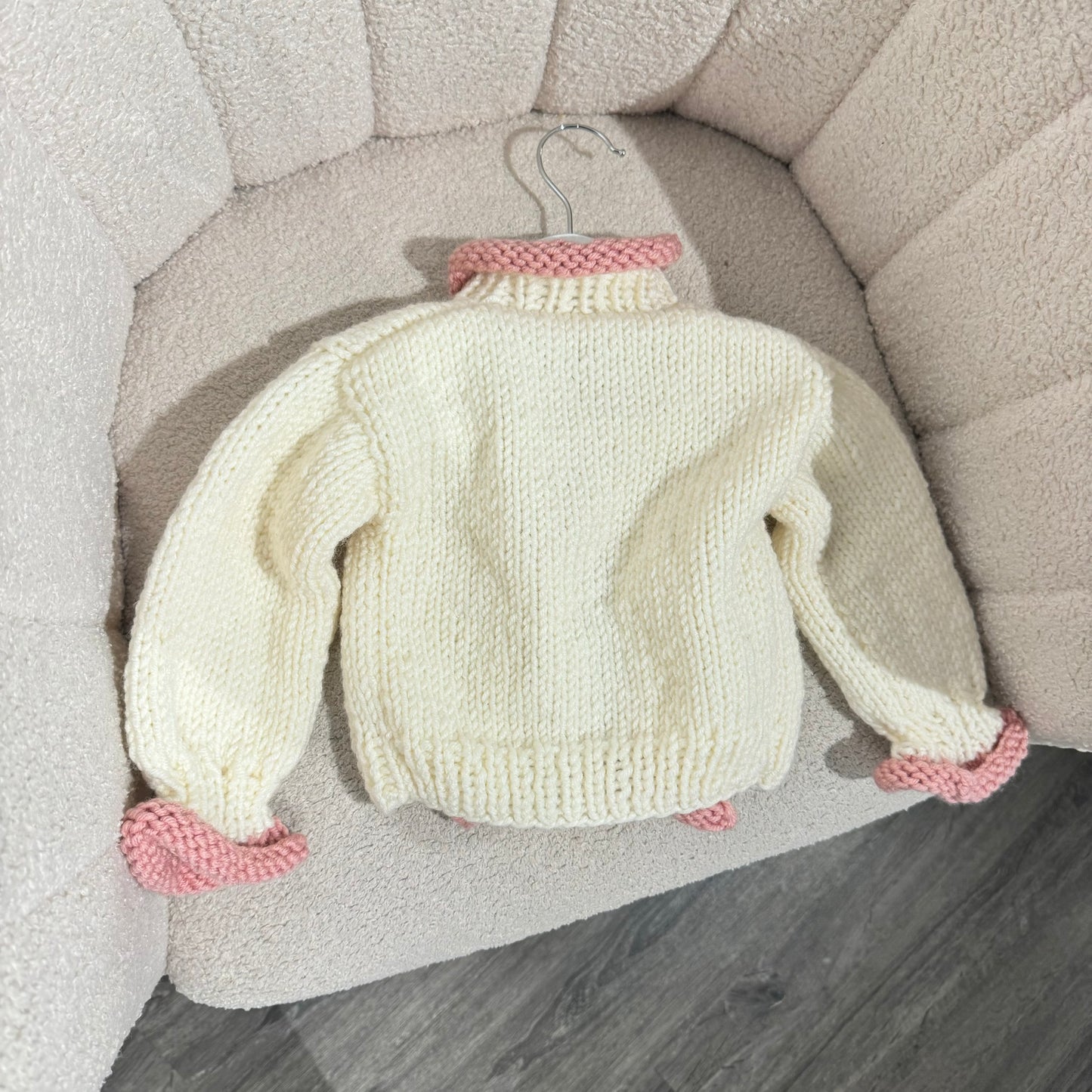In stock pink and white handknit cardigan