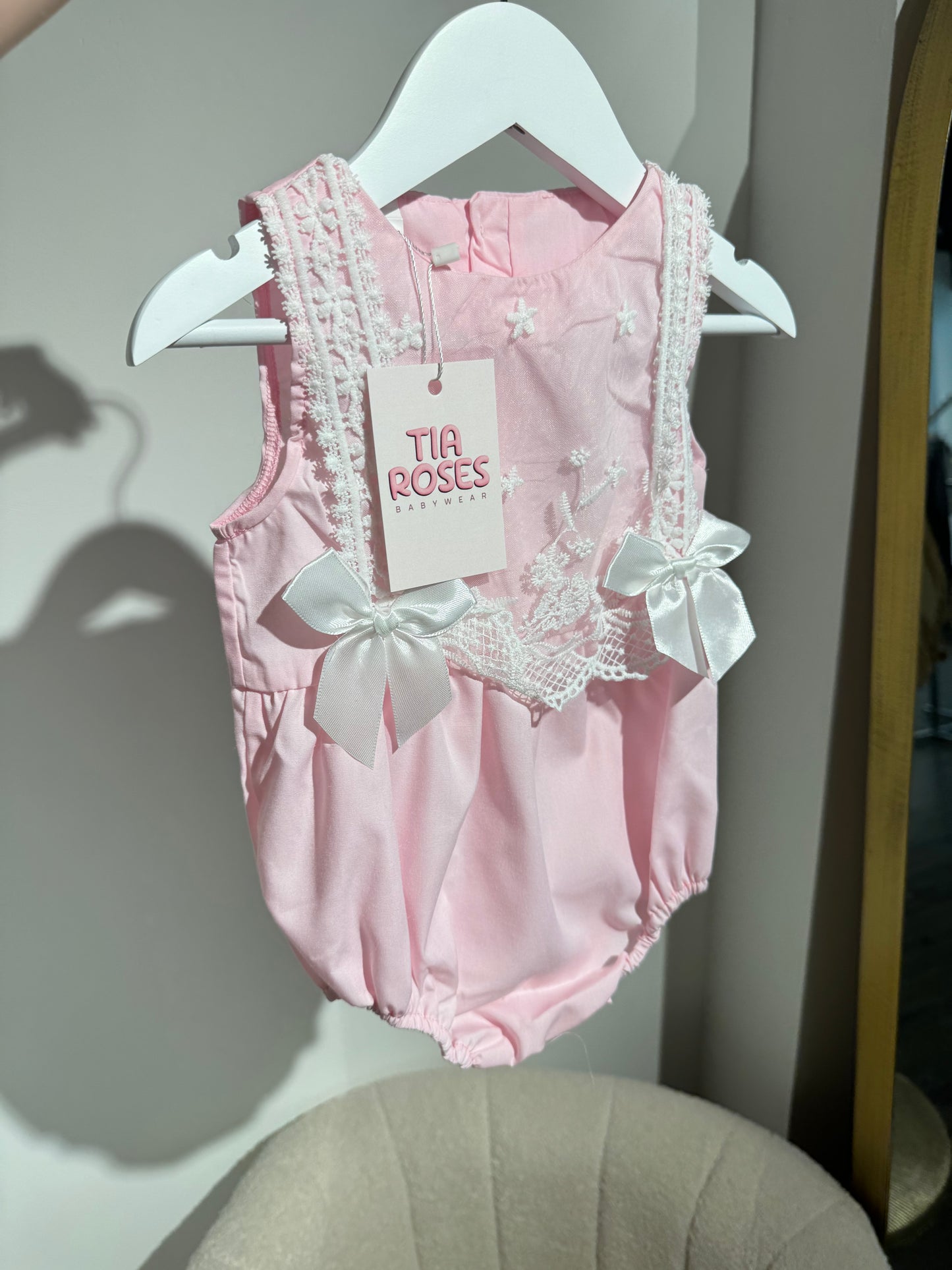 In stock pink silk bow romper