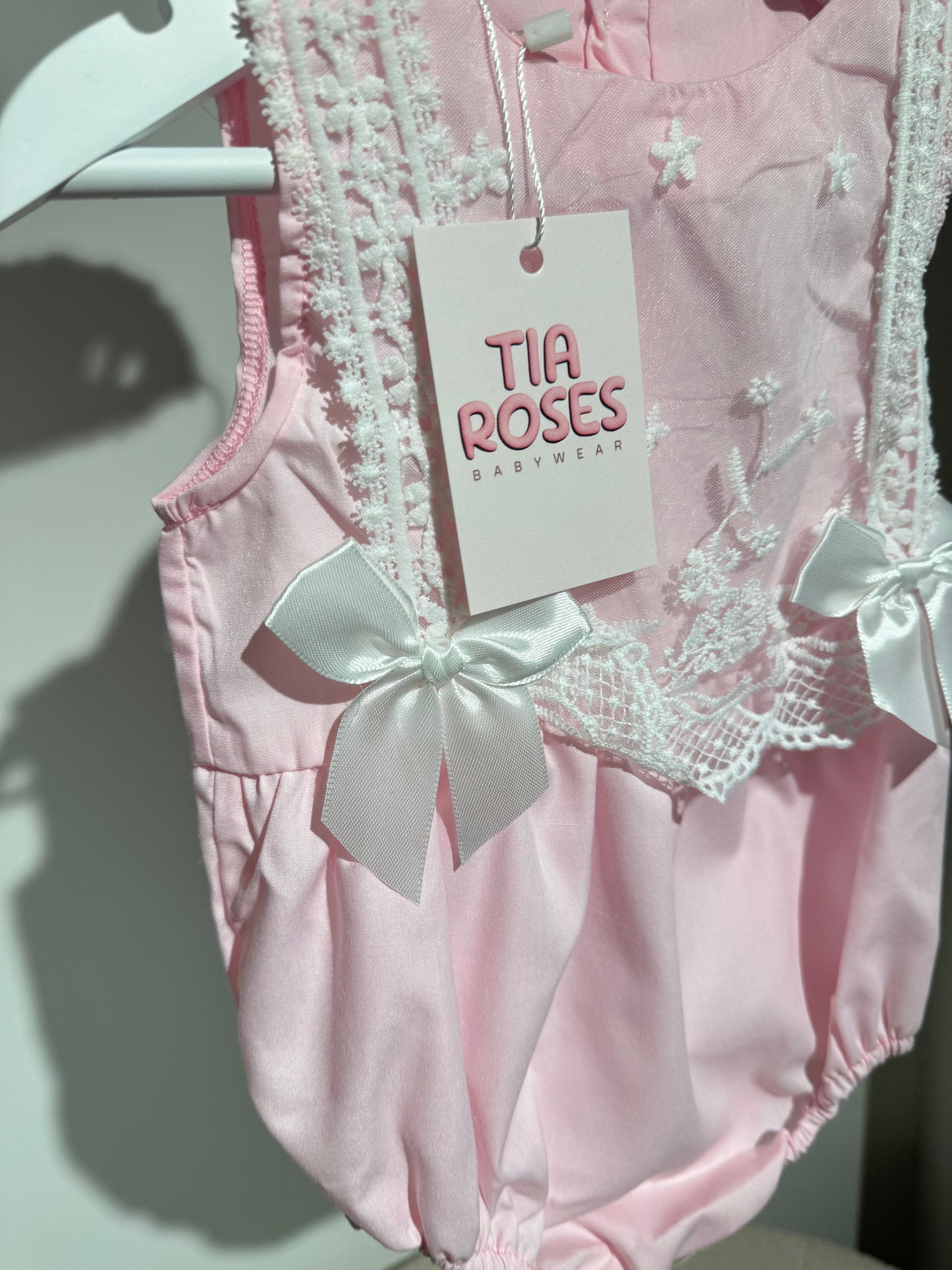 In stock pink silk bow romper
