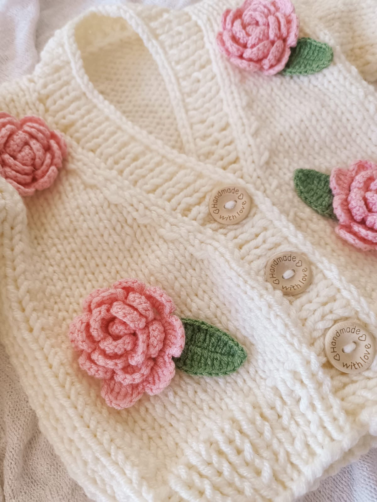 Pink handknitted rose cardigan