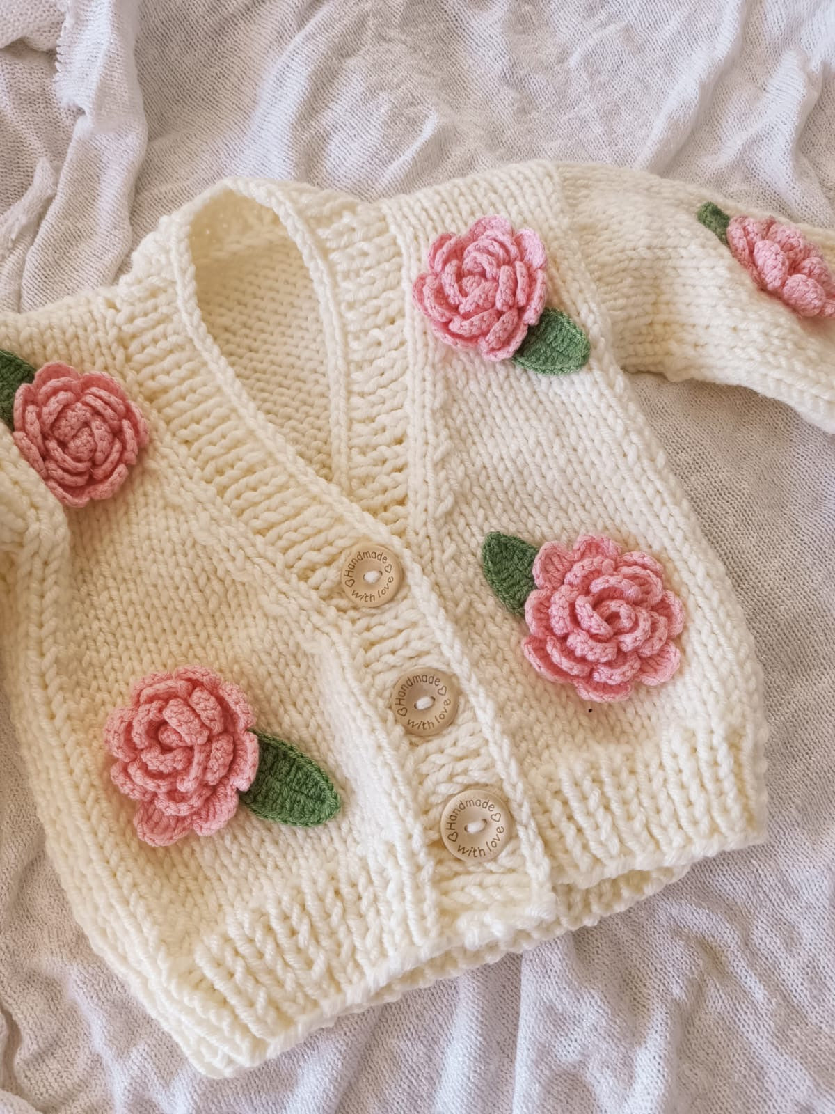 Pink handknitted rose cardigan