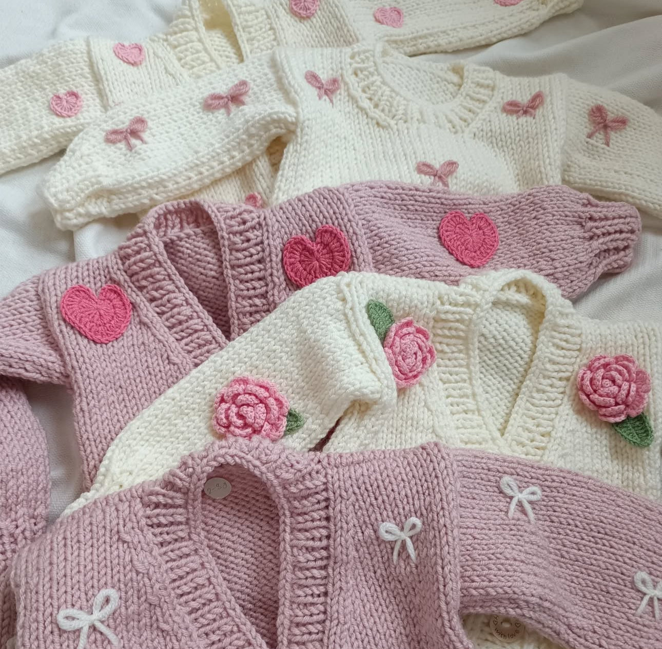 In stock cream and pink heart handknitted cardigan