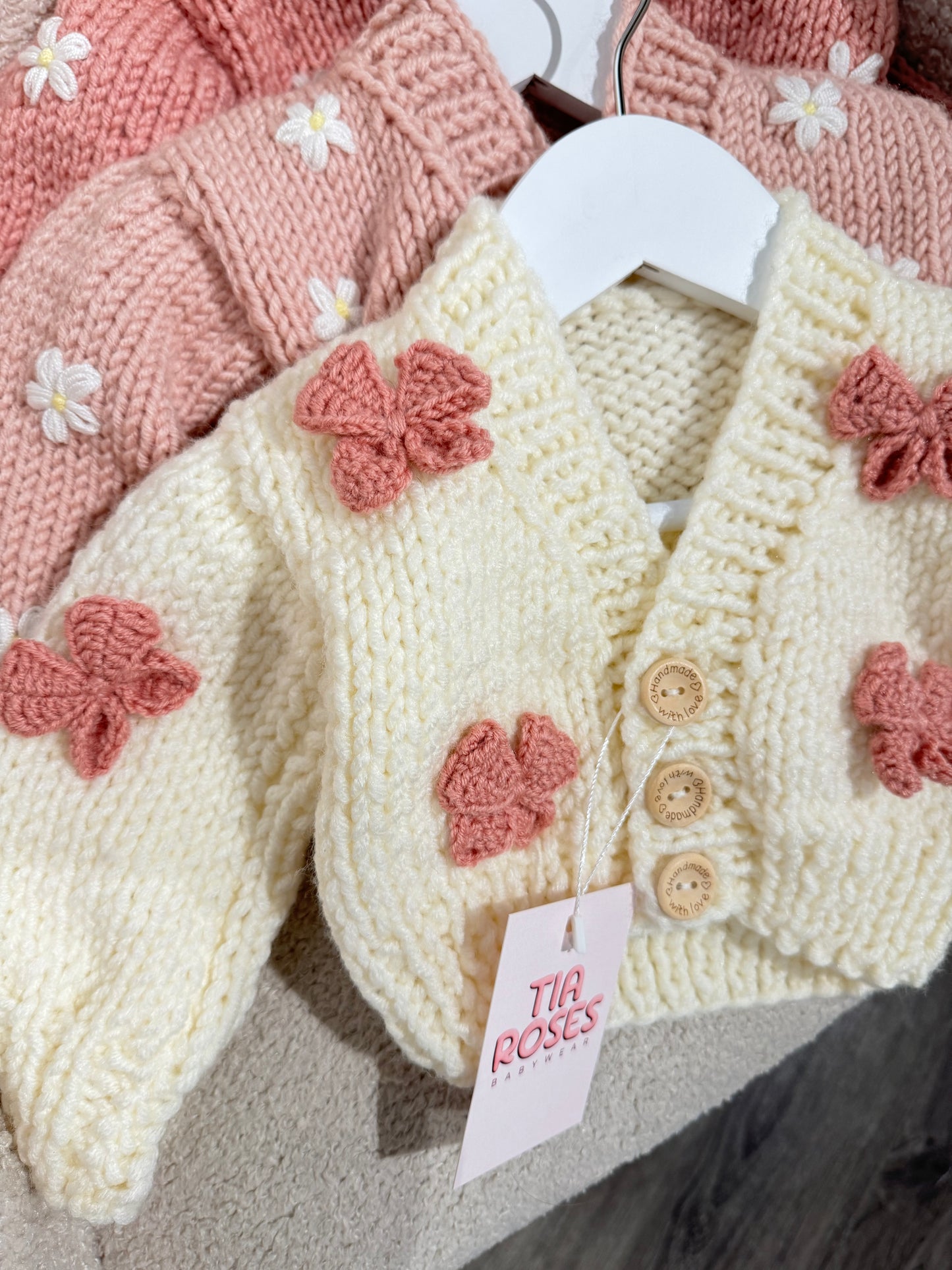 Hand knitted chunky cardigan cream bow