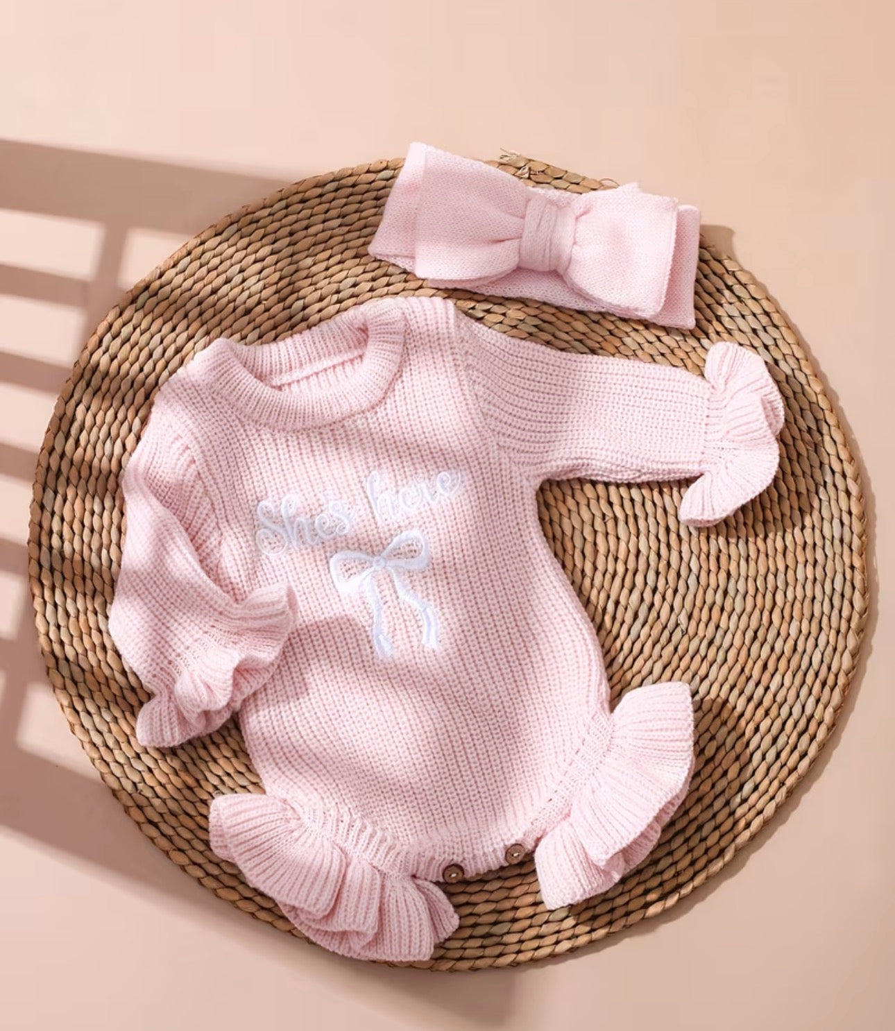 ‘She’s here’ embroidered baby pink frill romper & headband set