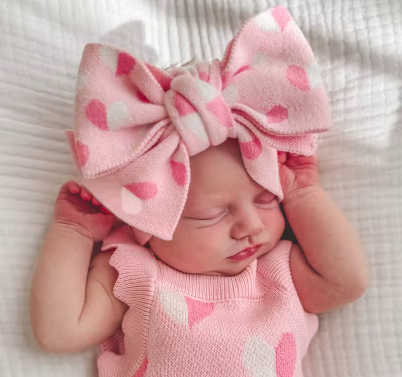 Thick knitted pink heart romper and giant tie headband