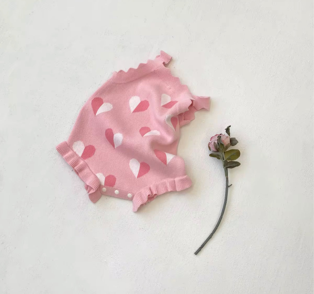Thick knitted pink heart romper and giant tie headband