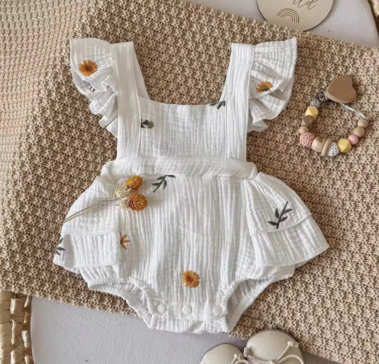 Embroidered flower white ruffle cross back romper
