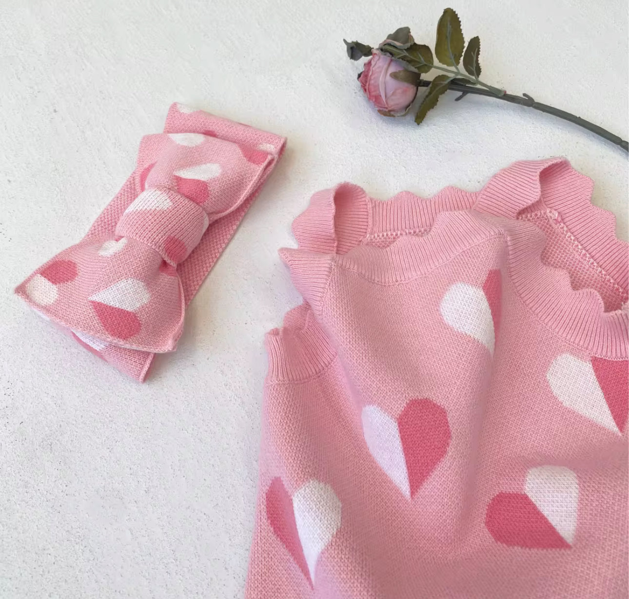 Thick knitted pink heart romper and giant tie headband