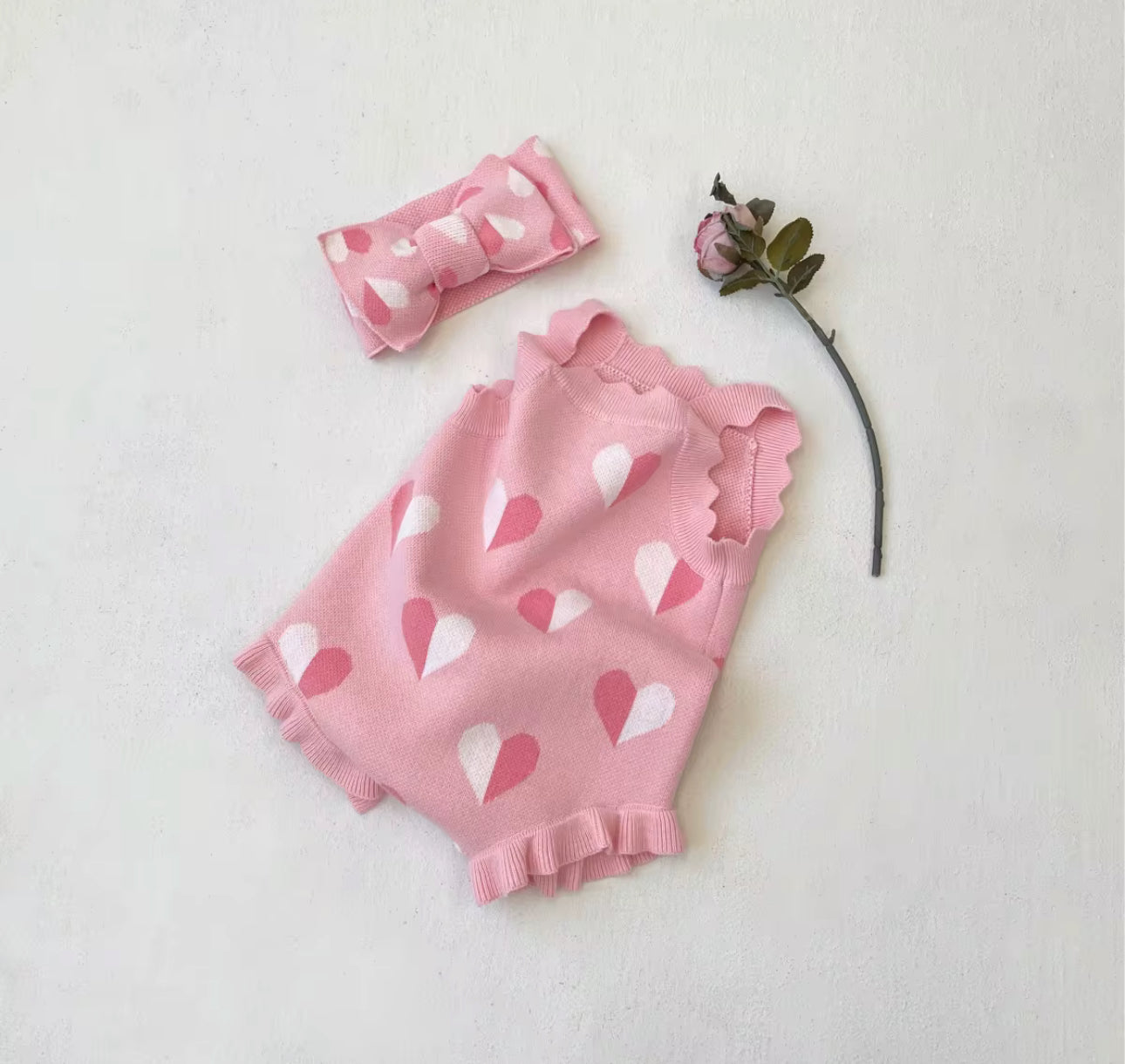 Thick knitted pink heart romper and giant tie headband