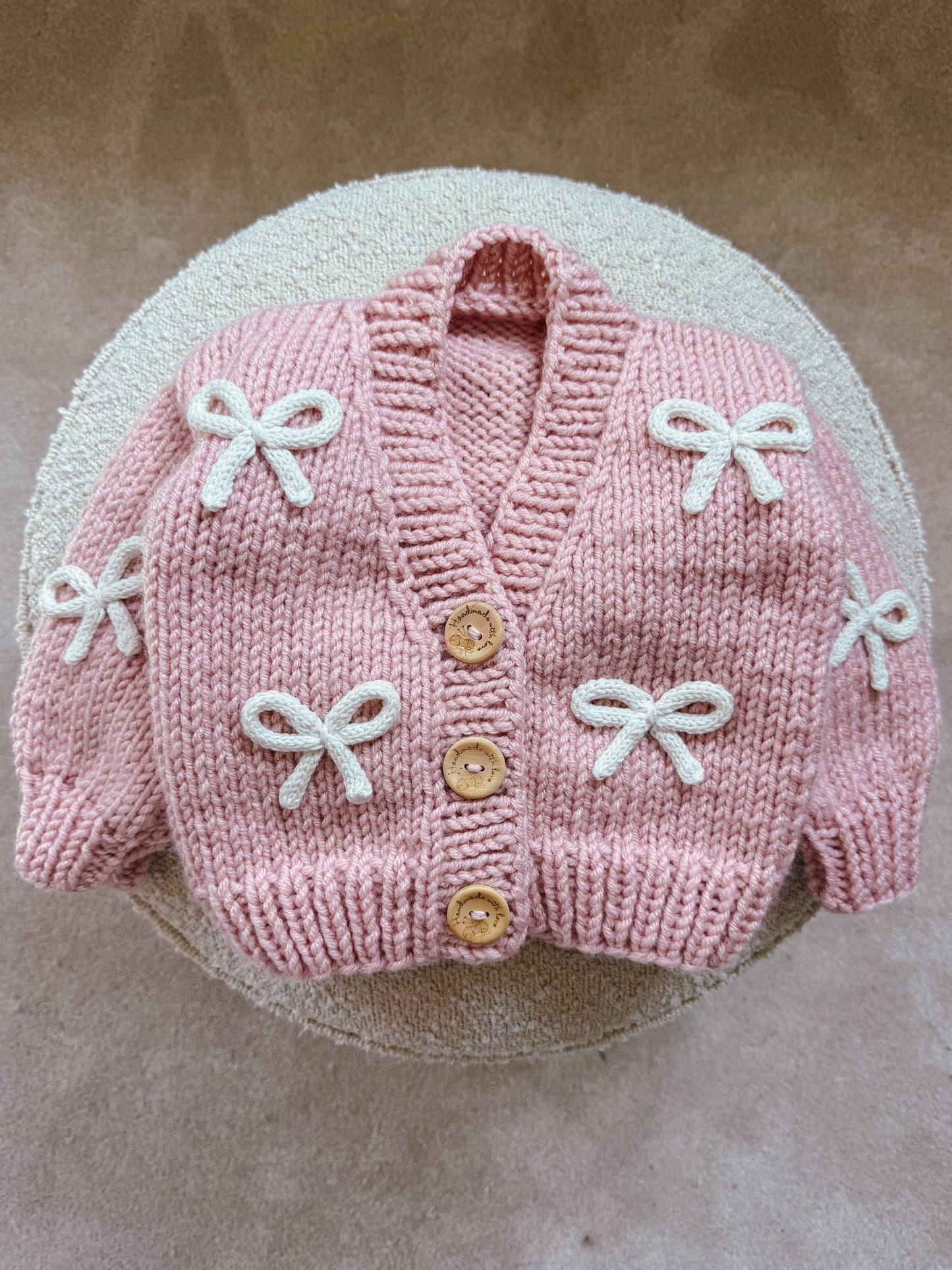 Handknitted rope bow cardigan
