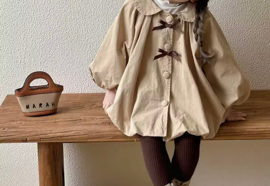 Thick oversized brown bow trench coat