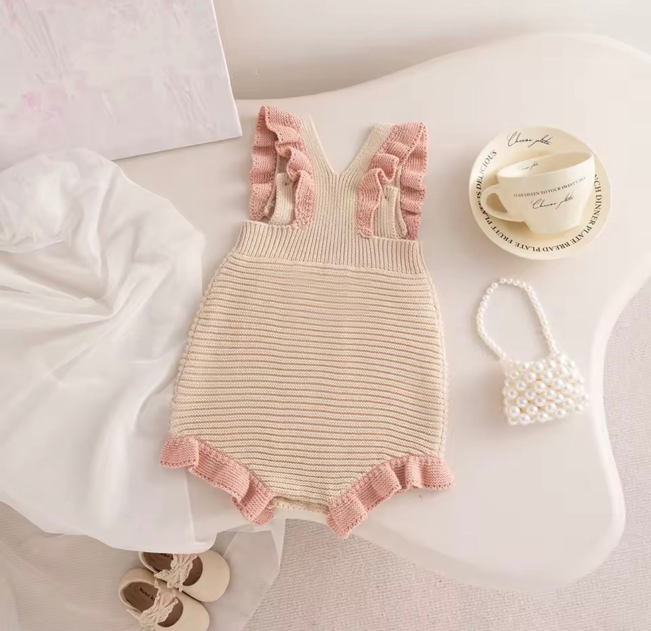 Beige and pink knit dot romper