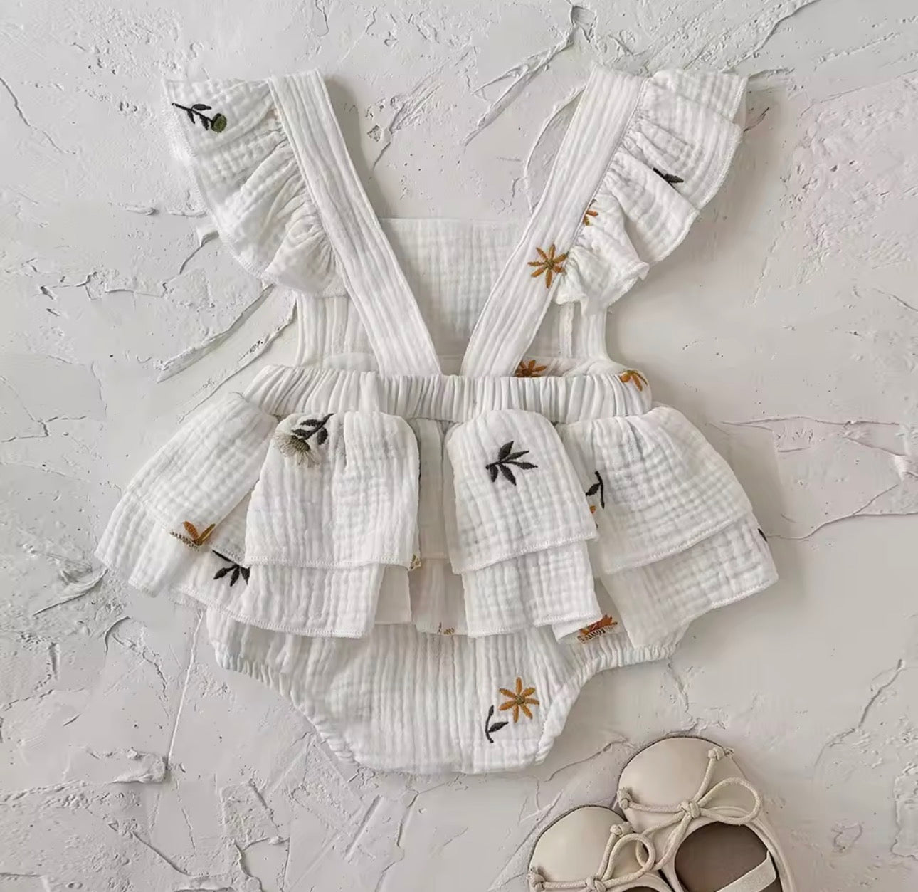 Embroidered flower white ruffle cross back romper
