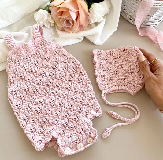 Handknitted rose pink romper/bonnet set