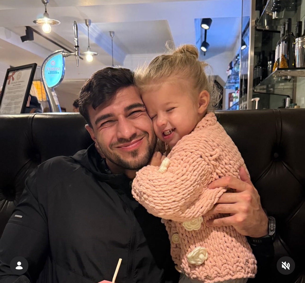 Soft handknit cardigan with knitted flowers