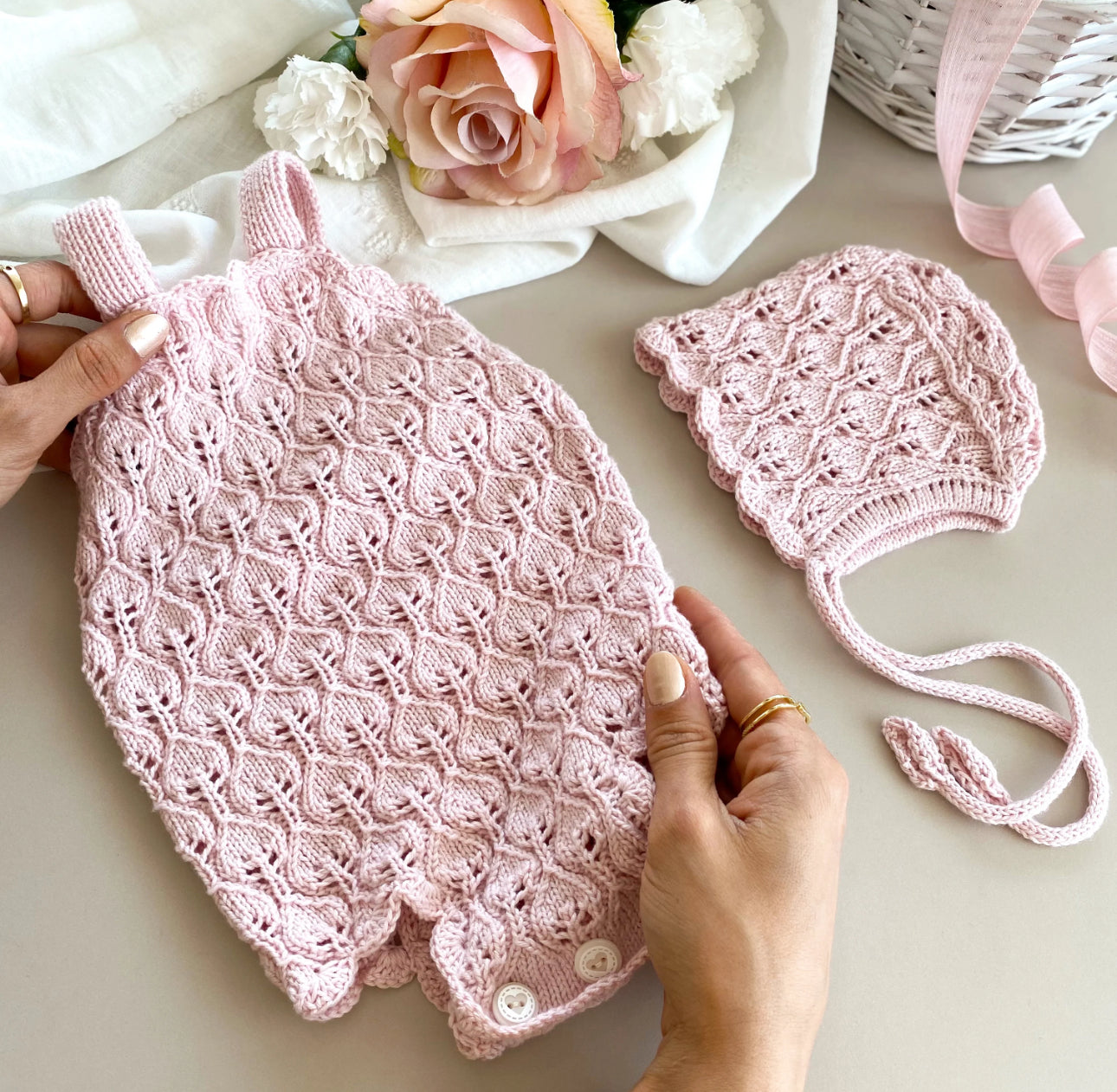 Handknitted rose pink romper/bonnet set