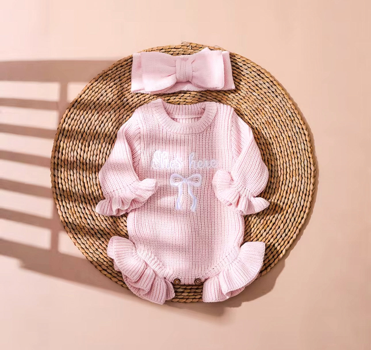 ‘She’s here’ embroidered baby pink frill romper & headband set