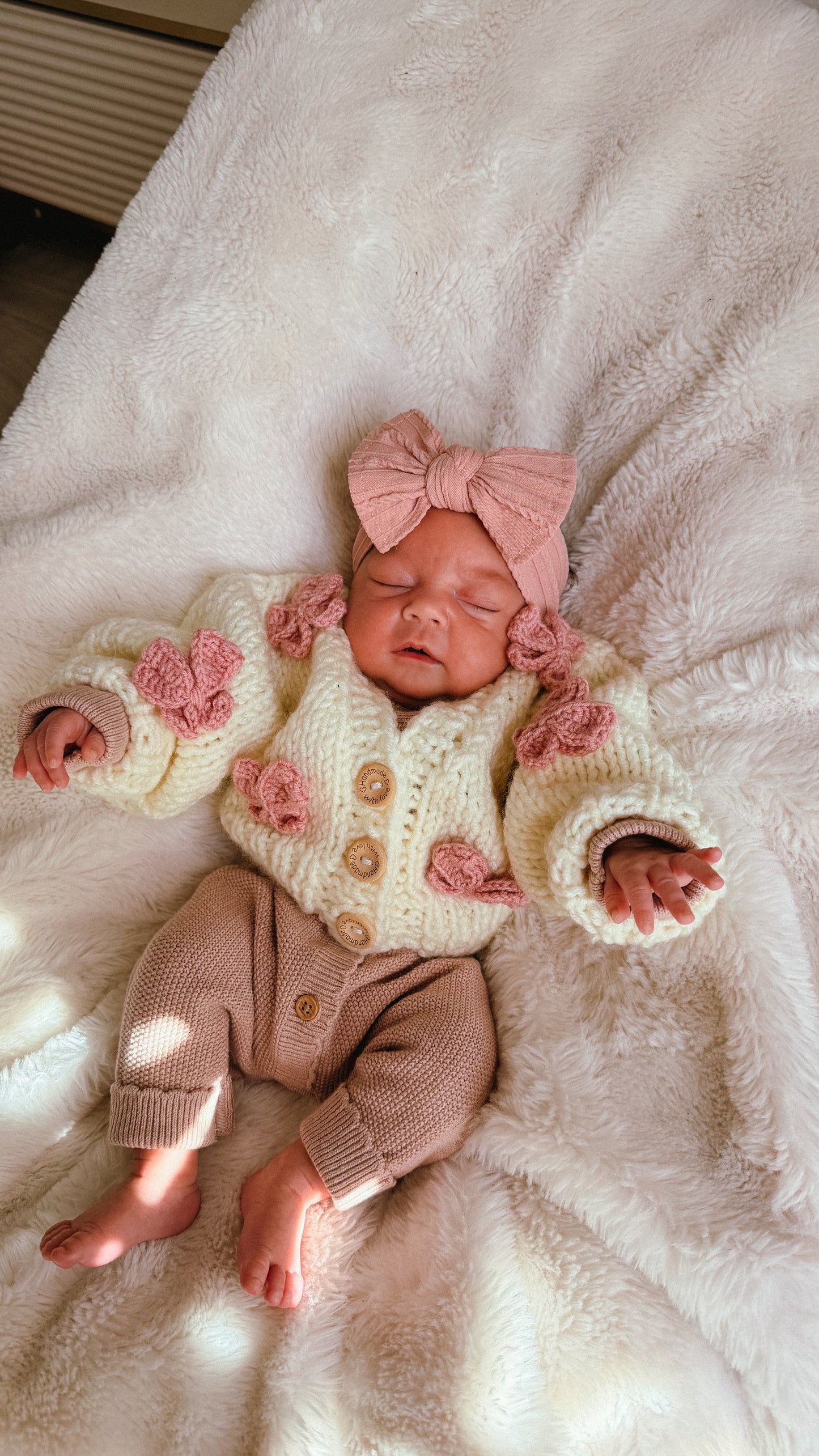 Hand knitted chunky cardigan cream bow